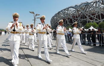 8 countries take part in military band parade at Beijing Olympic Park