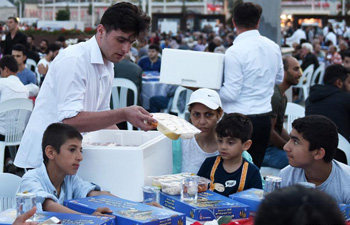 First fast-breaking meal of this year's Ramadan served at Taksim Square in Turkey