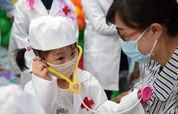 Children with leukemia participate in role play game as doctors in Chongqing, SW China
