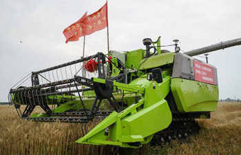 Unmanned sprayer, harvester, rice transplanter work in field in E China