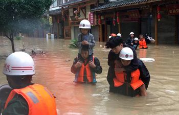 Rescuers evacuate residents as heavy rain hits NW China's Gansu