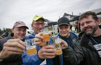 People taste craft beer at BC Hop Festival in Abbotsford, Canada