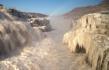 Rainbow over Hukou Waterfall of Yellow River