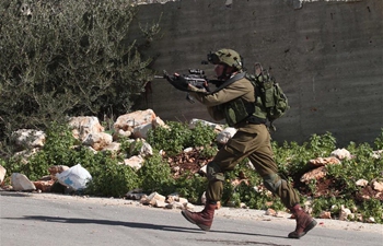 Israeli soldiers clash with Palestinian protesters near West Bank city of Nablus