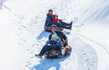 People enjoy winter sports at ski resorts in China