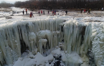 Amazing scenery of frozen waterfall in NE China's Heilongjiang