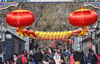 Tourists visit Nanluogu Alley in festive atmosphere in Beijing