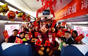 Staff members of bullet trains hold activities to extend greetings to passengers ahead of Spring Festival