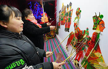 People enjoy folk arts during Chinese Lunar New Year holiday
