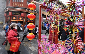 Tourists visit Qianmen street in Beijing during Spring Festival holiday