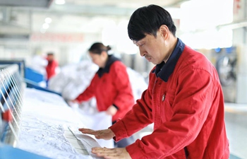 Staff members at train service center busy with work in SW China's Guizhou