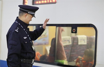 Police stick to posts during Spring Festival travel rush in railway station in China's Guizhou