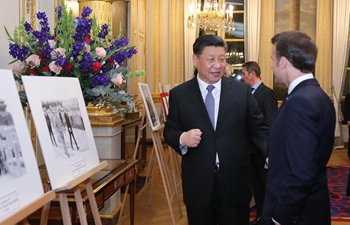 Xi, Macron visit photo exhibition at Elysee Palace
