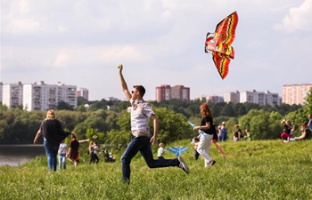People fly kites during Motley Sky festival in Moscow, Russia