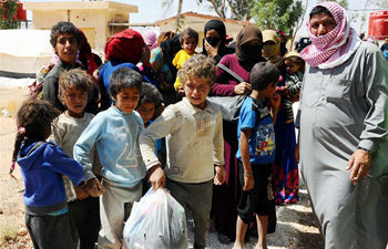 Batches of Syrian refugees return from Rukban camp
