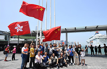 Feature: Hong Kong residents gather to express reverence to Chinese national emblem, flag