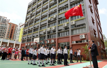 Association of Hong Kong Flag-guards holds flag raising ceremony at middle school
