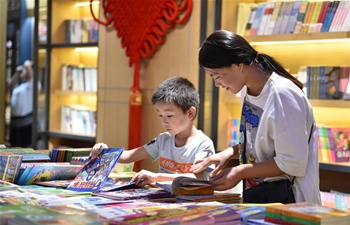 Readers browse books at Xinhua Bookstore in Dingzhou, China's Hebei