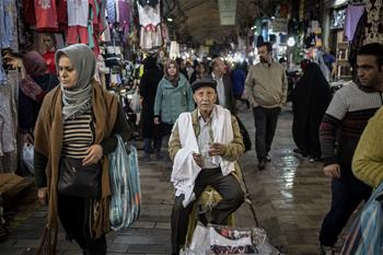 People shop at Grand Bazaar in Tehran, Iran