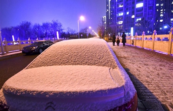 Snow falls in Beijing