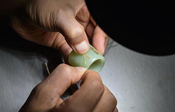 Pic story of renowned craftsman in gold and silver inlaid jade carving