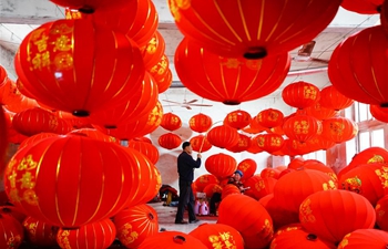Villagers make red lanterns for Spring Festival in north China's Hebei