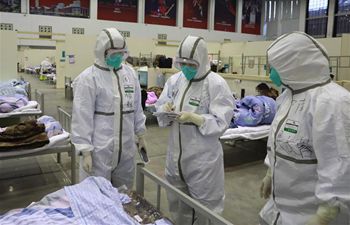 Medical workers treat patients at "Wuhan Livingroom"