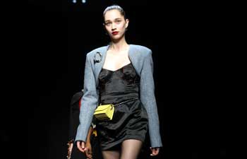 Models present creations by Han Wen at Milan Fashion Week