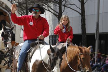 People participate in parade to greet upcoming Houston Livestock Show and Rodeo