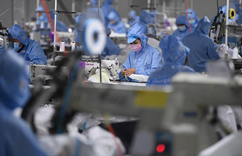 Production lines set up to produce protective suits in Deqing County, E China's Zhejiang