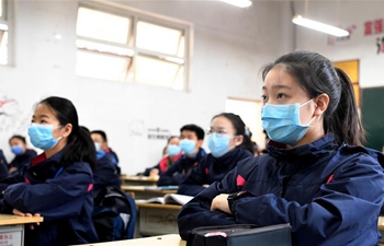 Students in final year of middle school return to school in Henan