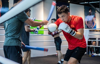 WBA featherweight world champion Xu Can of China attends training session