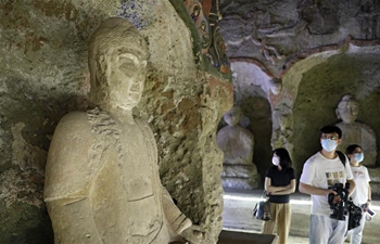 People visit Wanfotang grottoes scenic spot in Jinzhou City of China's Liaoning