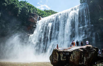 Tourists visit Chishui Waterfall in Guizhou, SW China