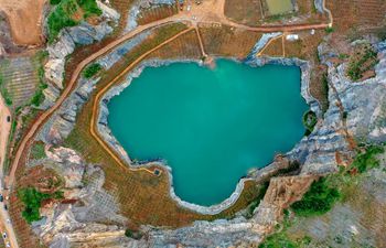 Open-pit mine becomes pond after afforestation