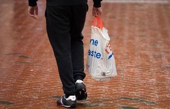 All shops in UK to charge for plastic bags from April 2021