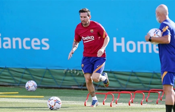Messi returns to training with Barcelona in Spain