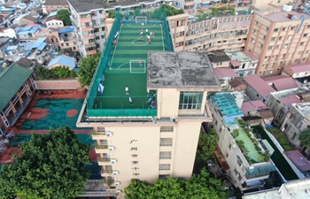 Sports field built on top of teaching building at middle school in Guangzhou