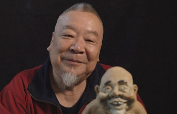 He portrays happy life with clay