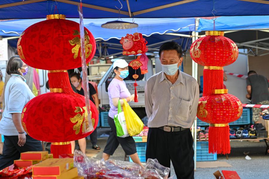 People shop for Chinese New Year decorations in Klang of Selangor state, Malaysia