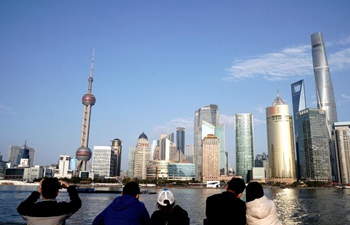 Tourists visit the Bund during Lunar New Year holiday in Shanghai