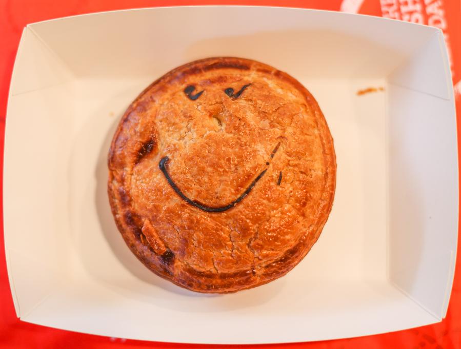 People buy meat pies in Sydney, Australia