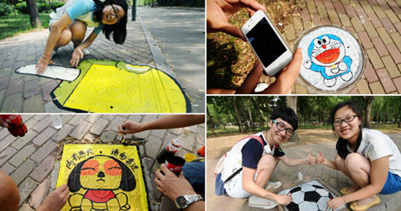 青岛大学生集体&ldquo;井盖涂鸦&rdquo;迎接毕业季[组图]