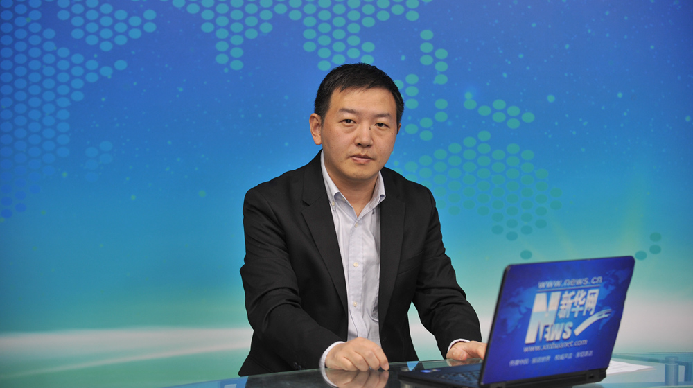 图为滴滴出行公司政府关系副总裁 王欣