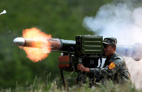 Members of antitank guided-missiles family gather in tactical drill