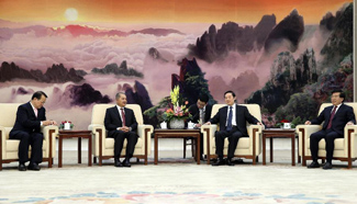 Liu Qibao meets Lao People's Revolutionary Party delegation in Beijing