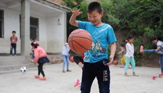 Volunteers, kids celebrate Children's Day in Peiling Village