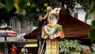 Hindu devotees worship statue of snake during Hindu festival