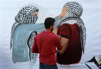 Artists paint murals in support of Palestinians in Gaza