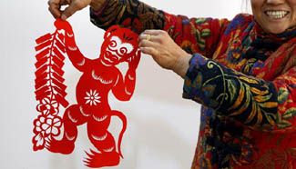 In pics: folk paper-cutting creation for Year of Monkey